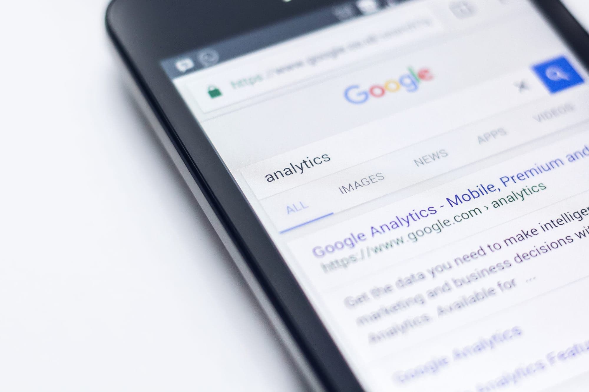 Smartphone showing a Google search for analytics
